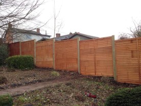 After - overlap panels on timber posts