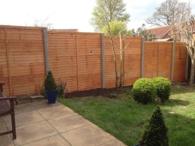 After - overlap panels on concrete posts