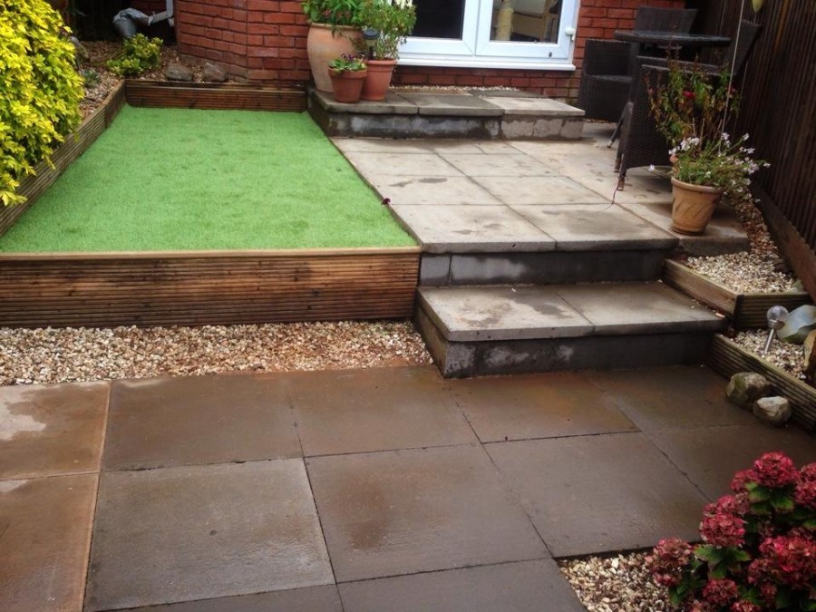 Extended patio and artificial grass after